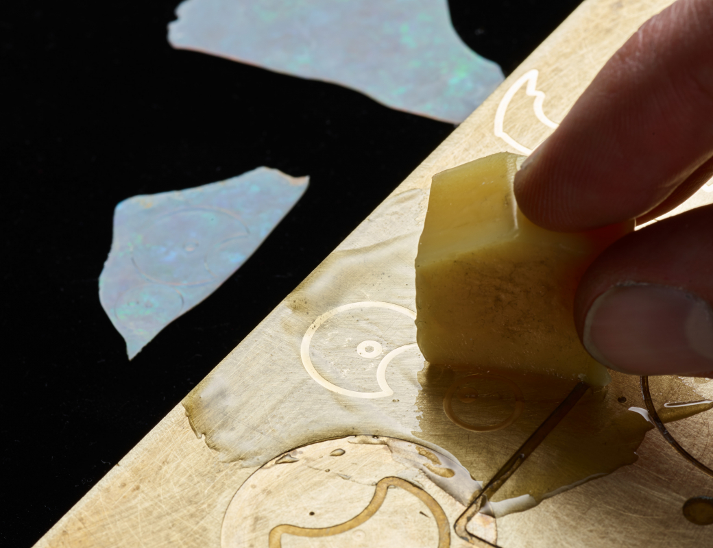 Lining_up_an_opal_slice_used_for_making_the_dial_of_the_Romain_Gauthier_Insight_Micro-Rotor_Lady_Opal